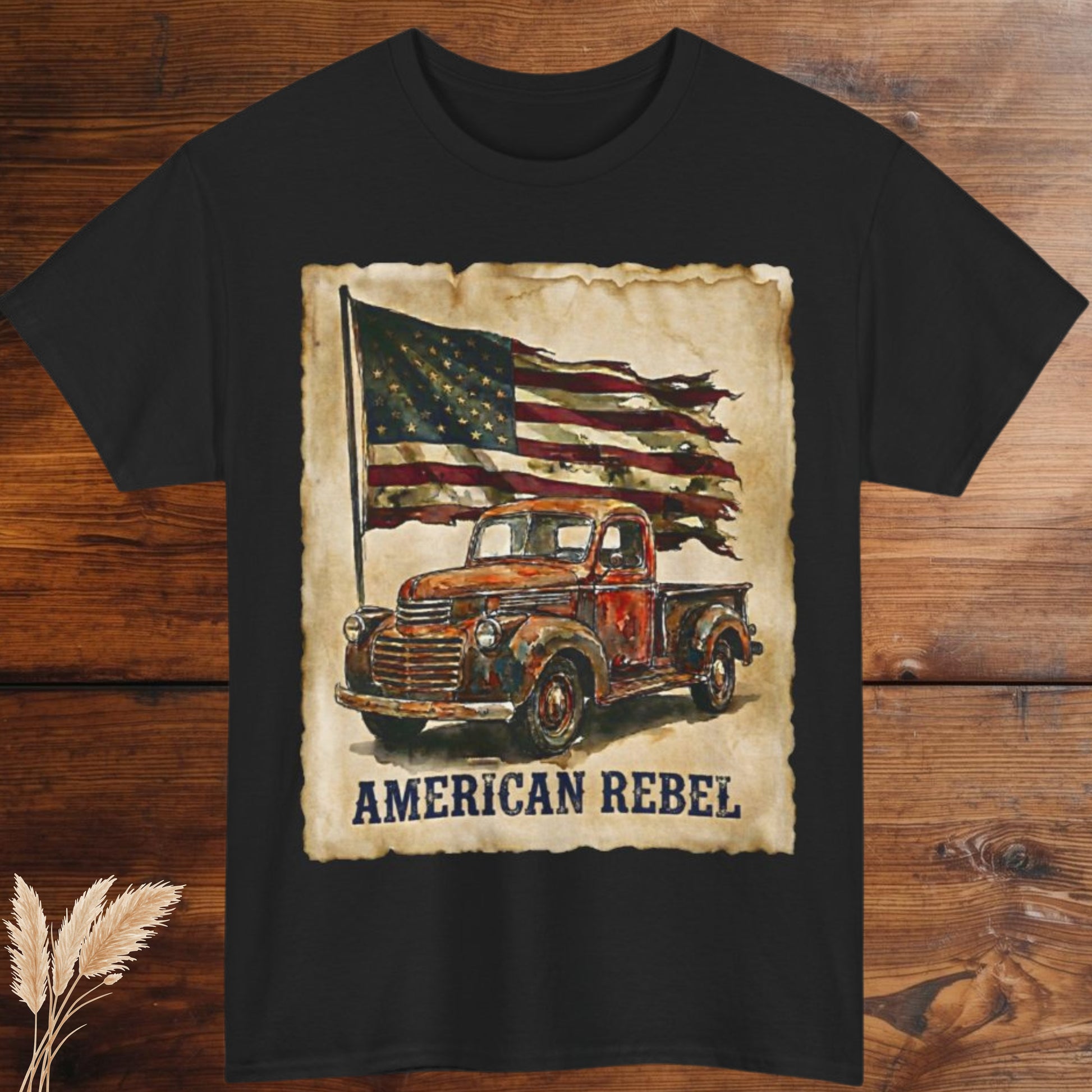 Black t-shirt with vintage truck and American flag graphic on a wooden surface